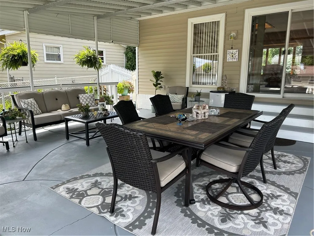 View of patio / terrace featuring an outdoor living space and outdoor dining area