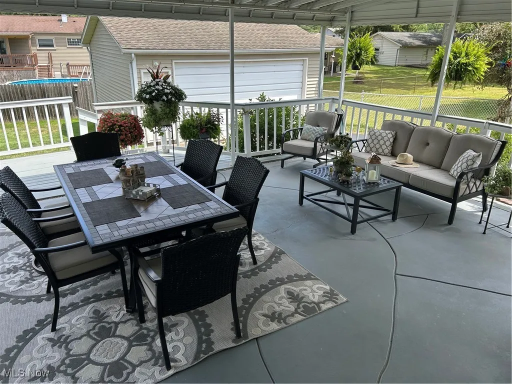 View of patio / terrace featuring an outdoor hangout area and outdoor dining space