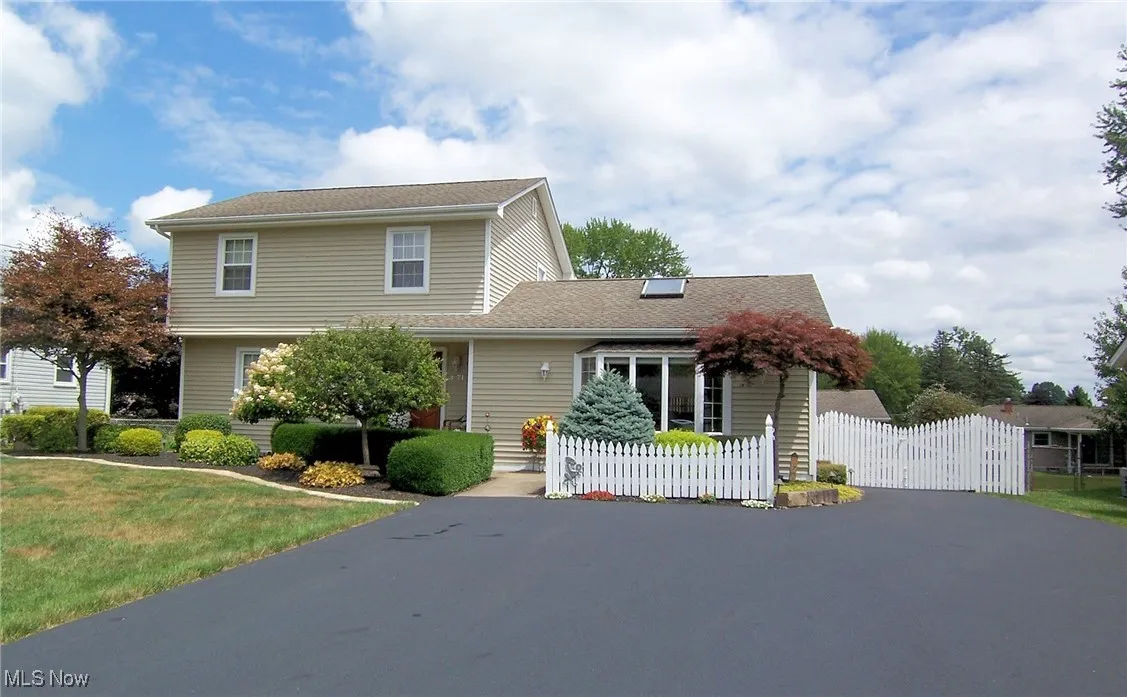 View of front of house featuring a gate