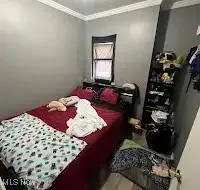 Bedroom with crown molding