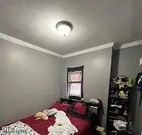 Bedroom with ornamental molding
