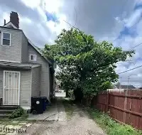 View of side of home with a chimney