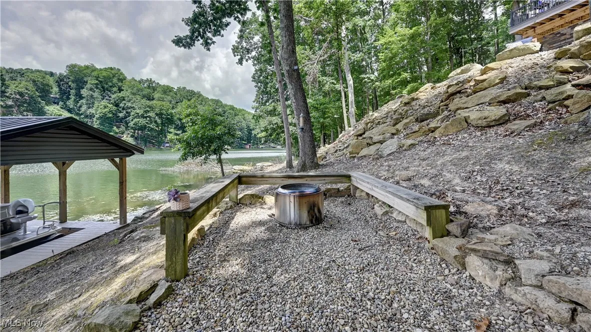 Firepit sitting area by dock.