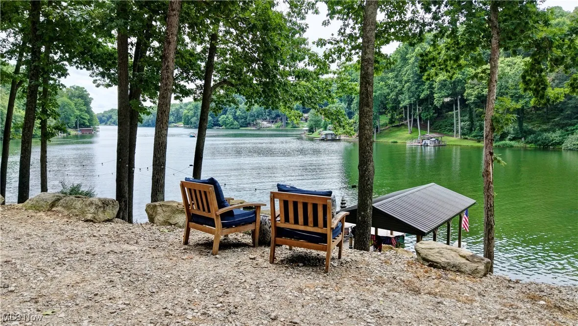 Dock area featuring a water view