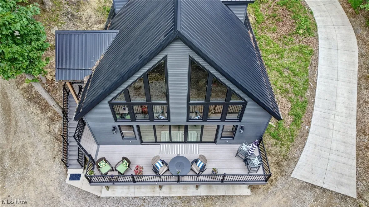  house featuring a balcony and a porch