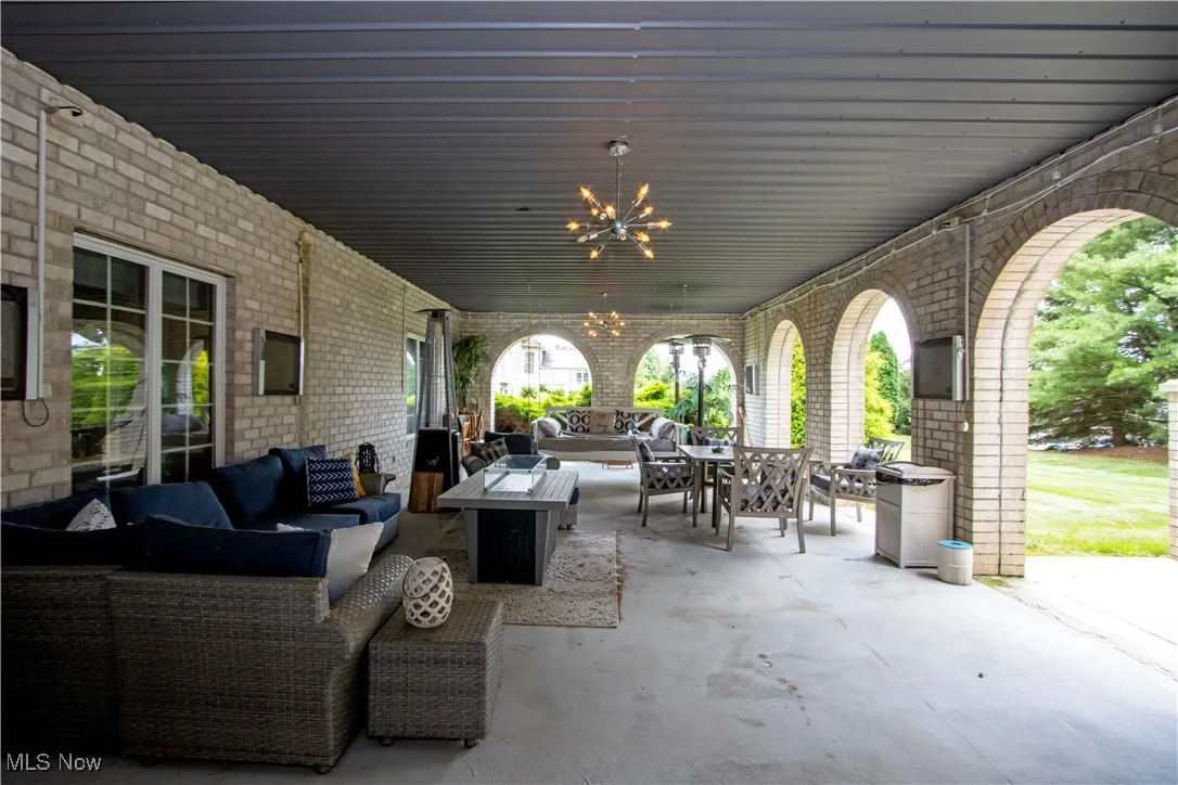 View of patio / terrace of lower level featuring outdoor lounge area and outdoor dining space