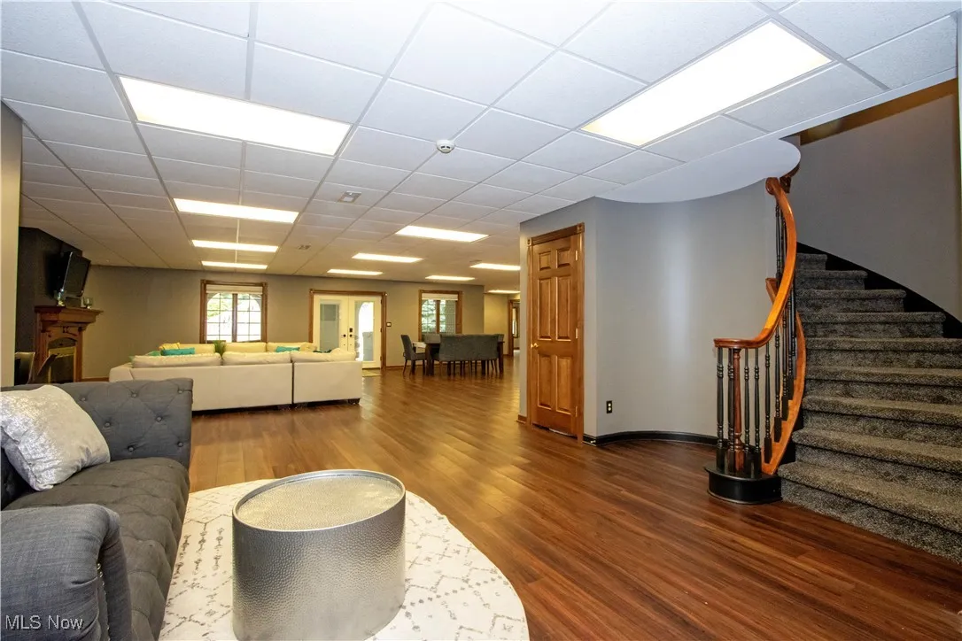 Living area featuring dark wood-type flooring and stairway
