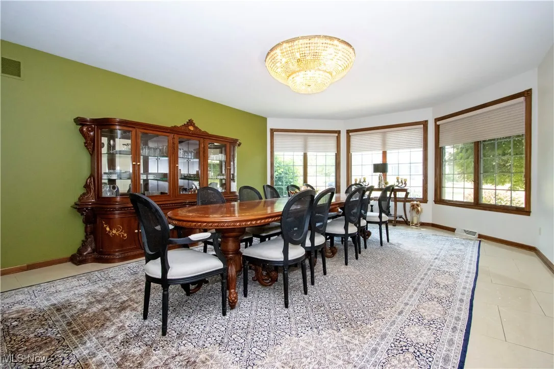 Tiled dining space with plenty of natural light