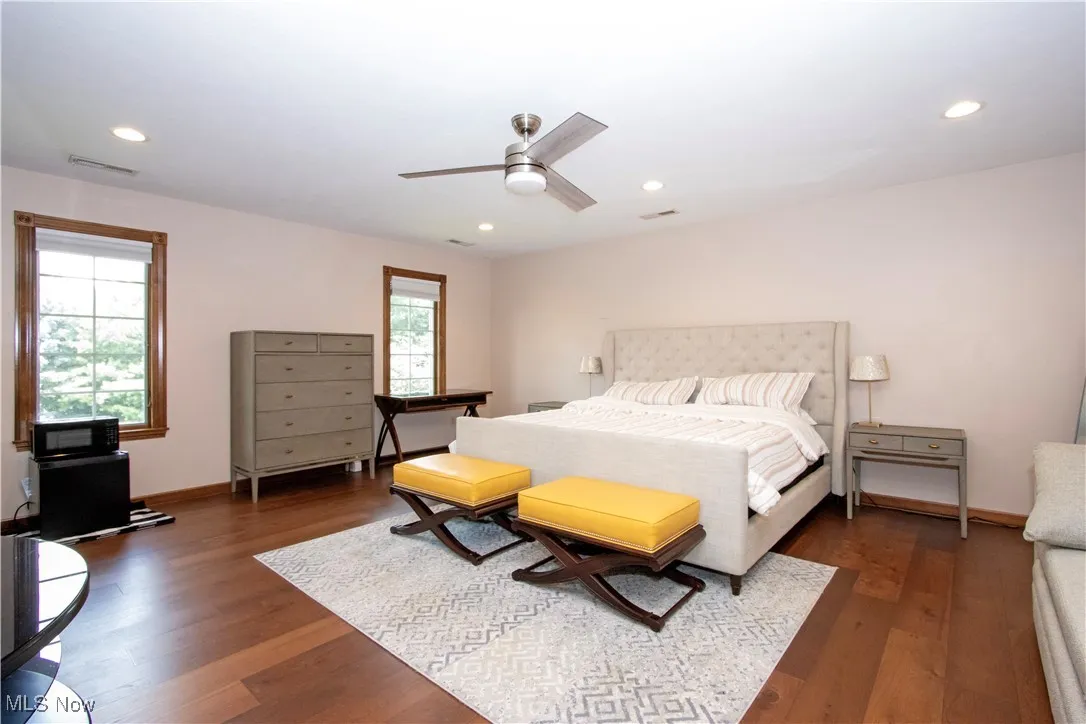 Bedroom featuring wood finished floors, recessed lighting, and a ceiling fan