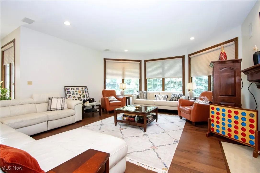 Living room with wood finished floors and recessed lighting