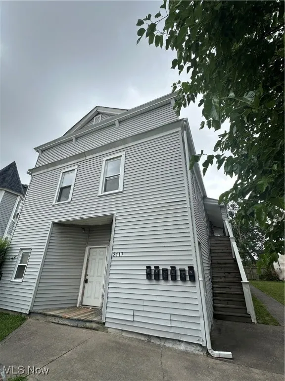 View of front of home featuring stairs