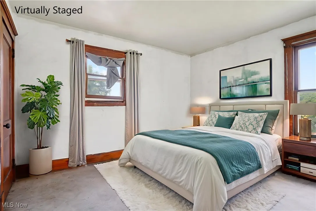 Bedroom featuring concrete floors
