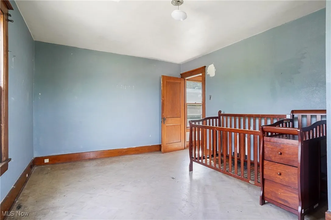 Spare room with tile patterned floors and baseboards