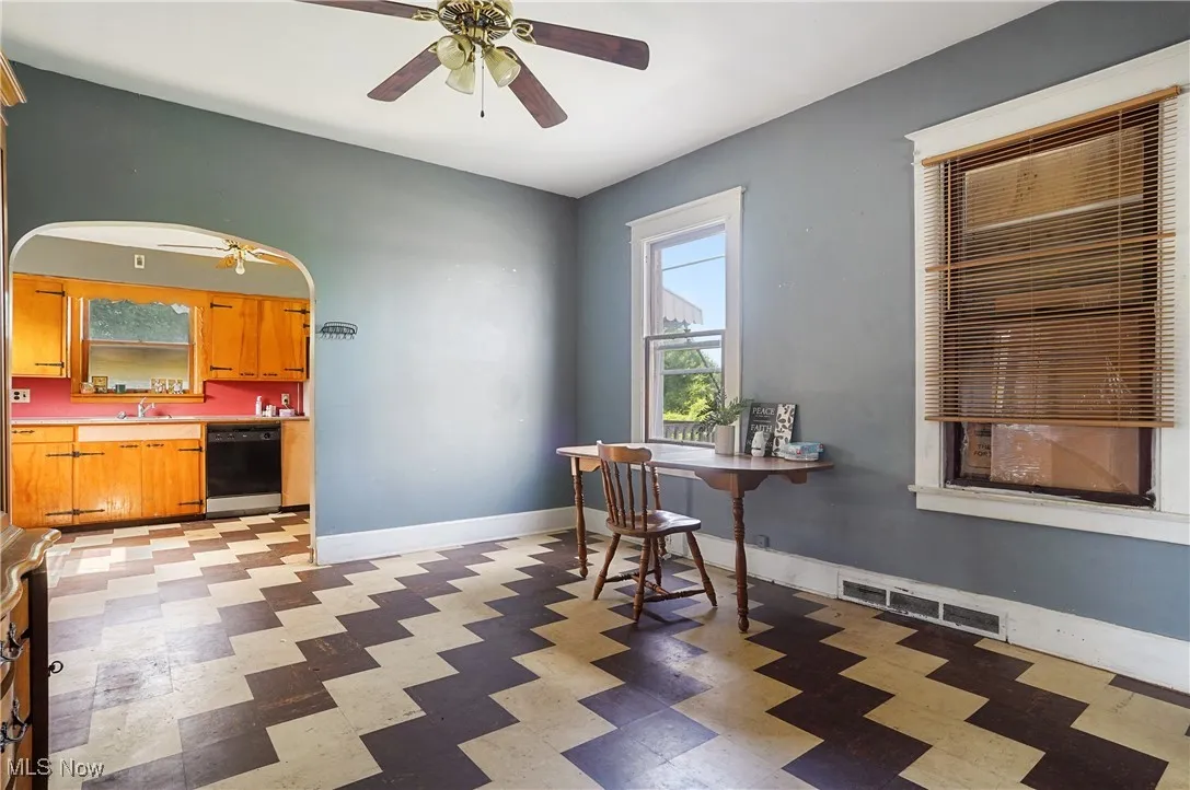 Dining area featuring ceiling fan and light floors