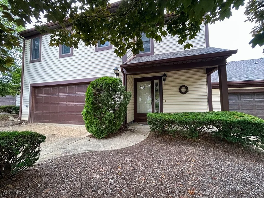 View of front of property featuring concrete driveway and a 2 car garage