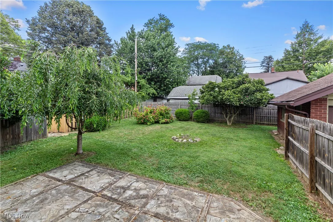 Fenced backyard with a patio area