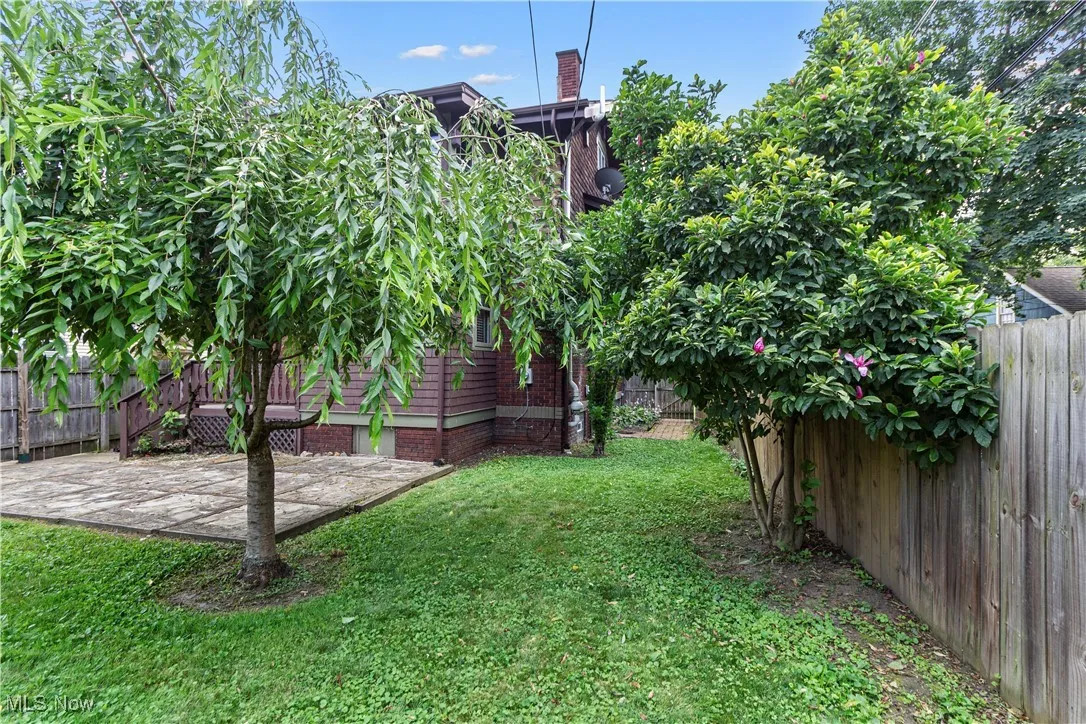 Fenced backyard with a patio area