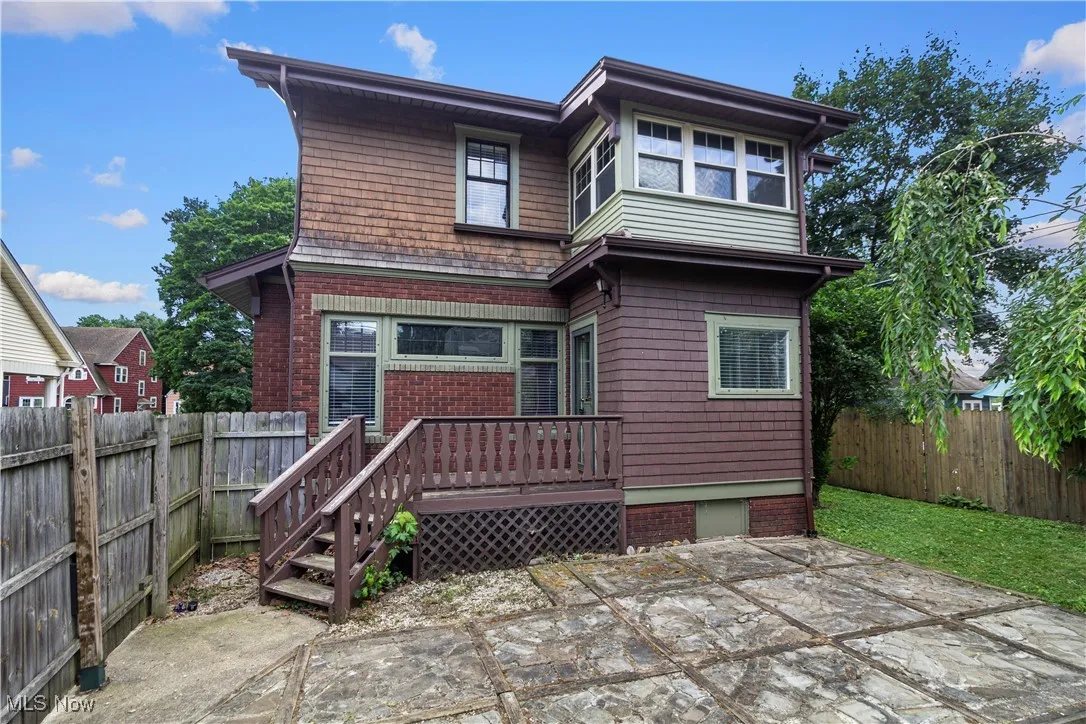 Rear view of property with a patio and a fenced backyard