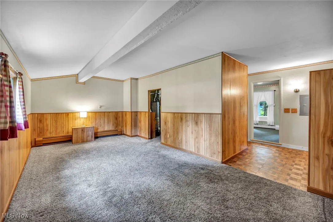 carpeted floor offering an additional living space or spare room