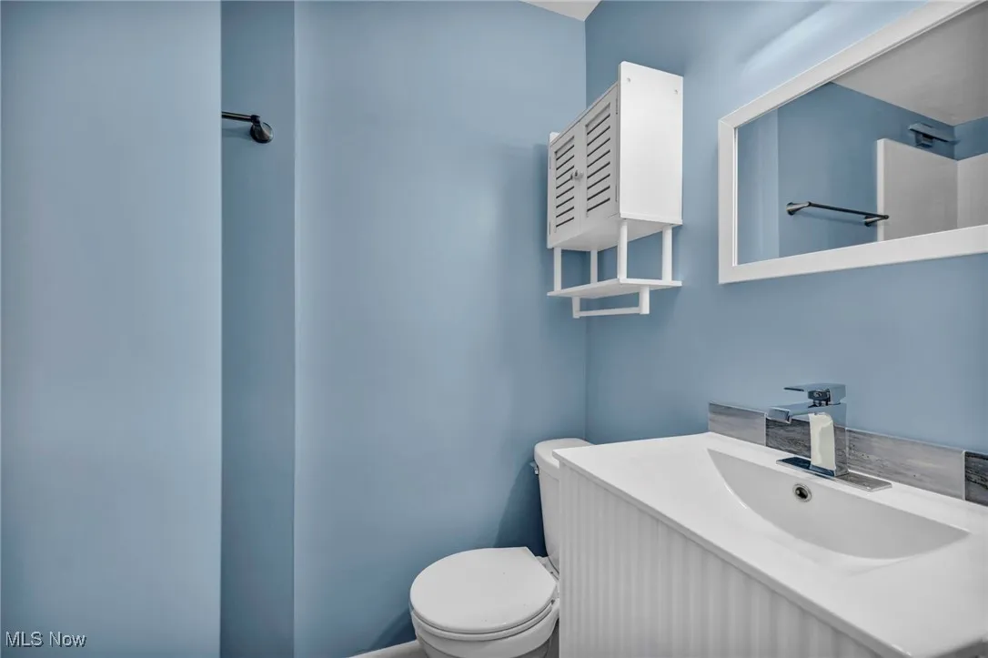Bathroom with toilet and vanity