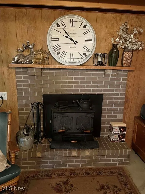 Detailed view of a wood stove and wooden walls