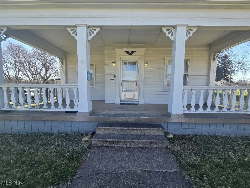Entrance to property with a porch