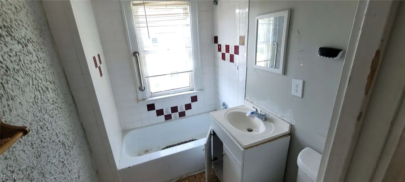 Bathroom with vanity and toilet