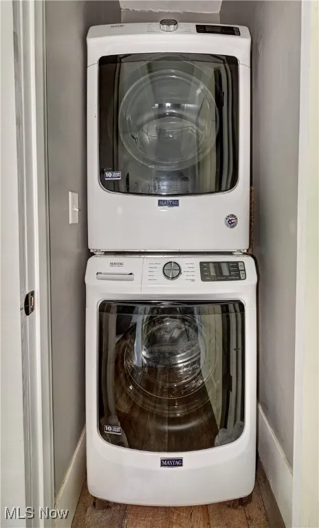 Laundry area with stacked washing machine and dryer