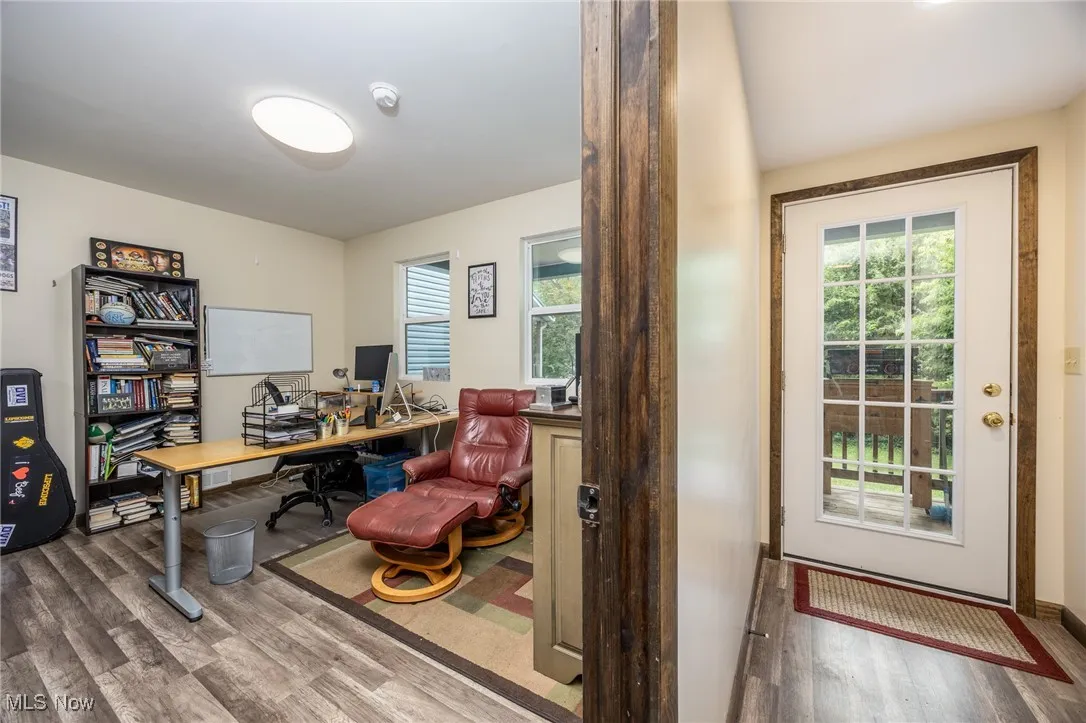 Office area featuring wood finished floors and healthy amount of natural light