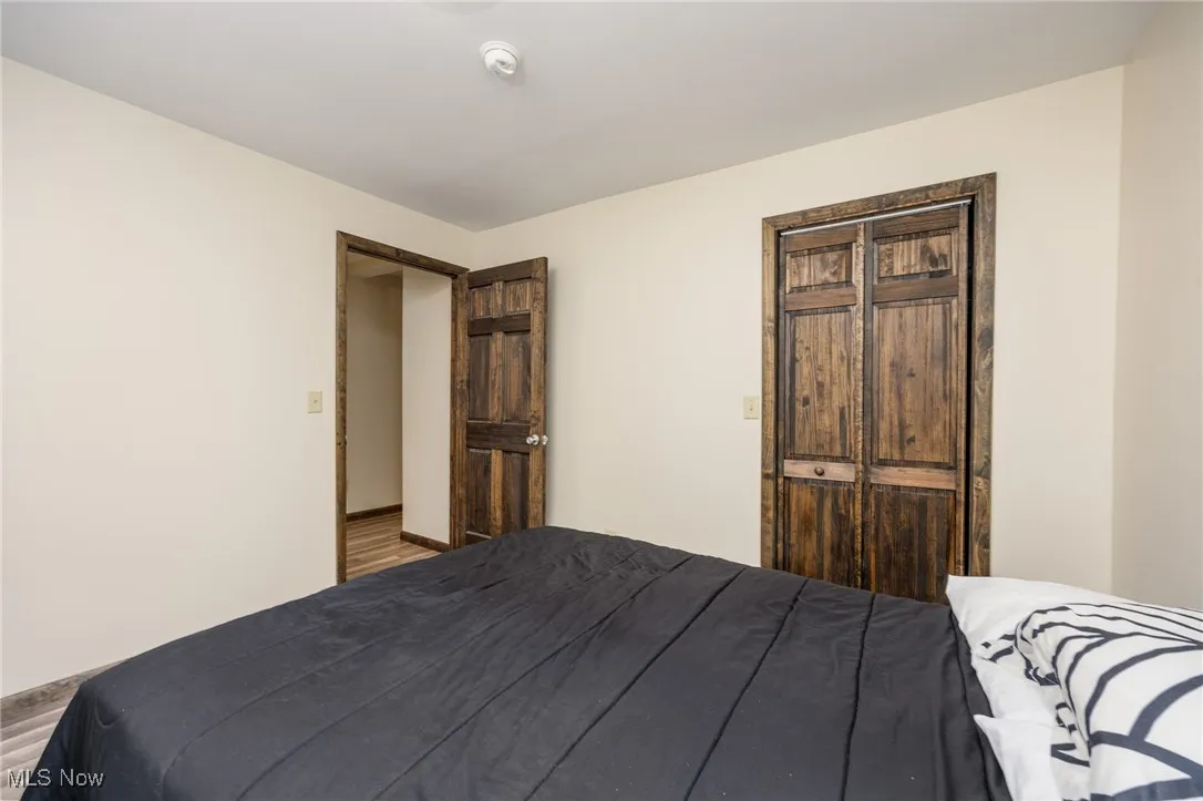 Bedroom with wood finished floors