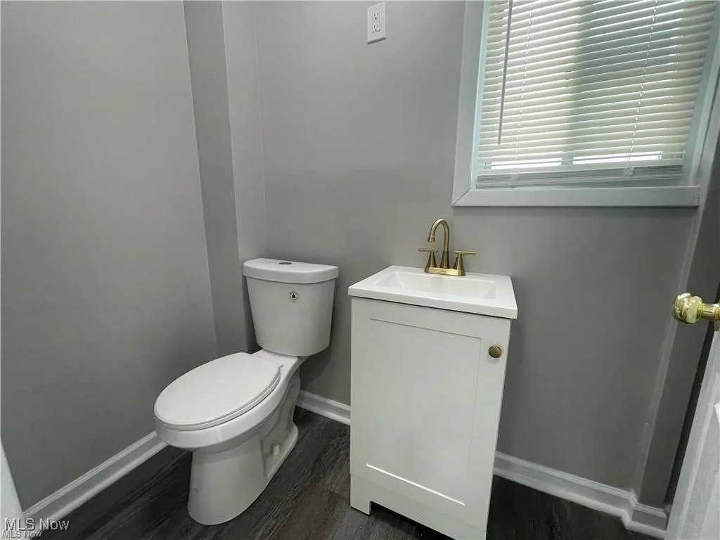 Bathroom featuring vanity and wood finished floors