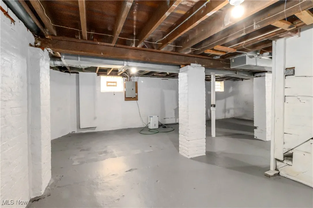 Basement featuring plenty of natural light and electric panel