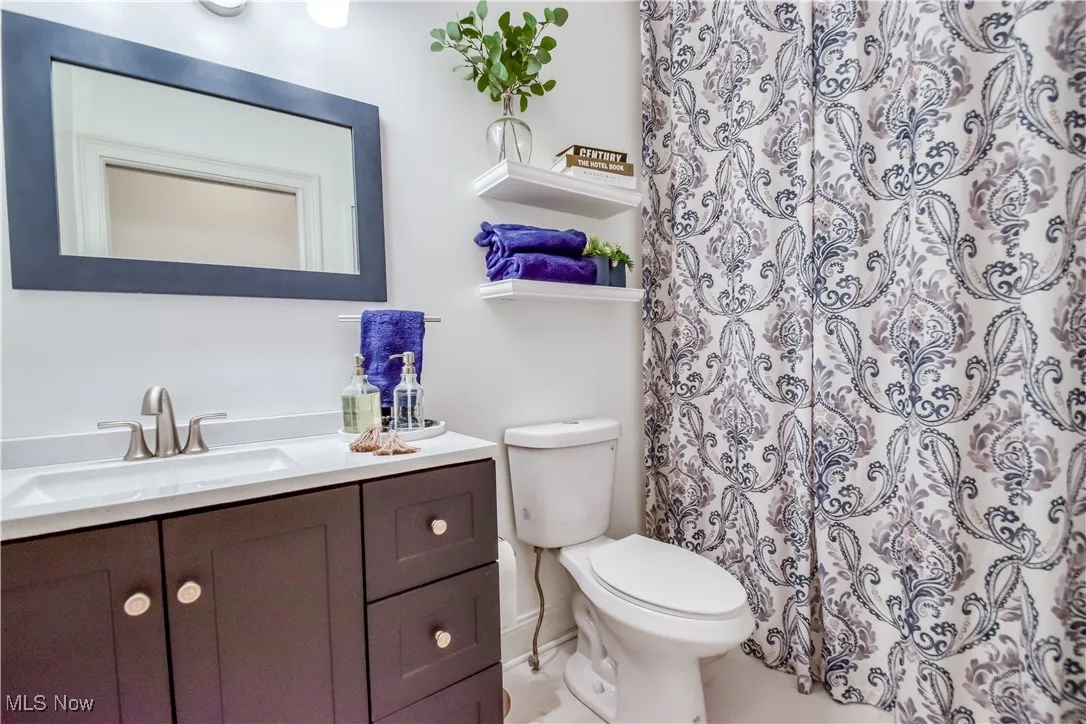 Bathroom featuring vanity and a shower with curtain