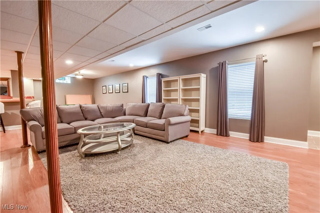 Living room featuring wood finished floors and recessed lighting