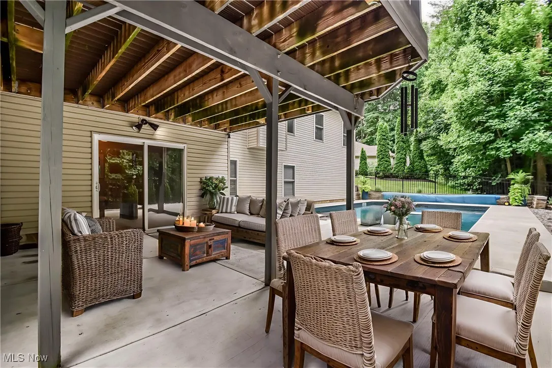 View of patio featuring outdoor lounge area - virtually staged