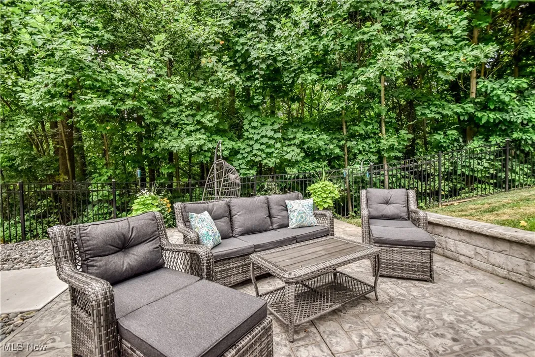 Fenced backyard featuring a patio area and outdoor lounge area