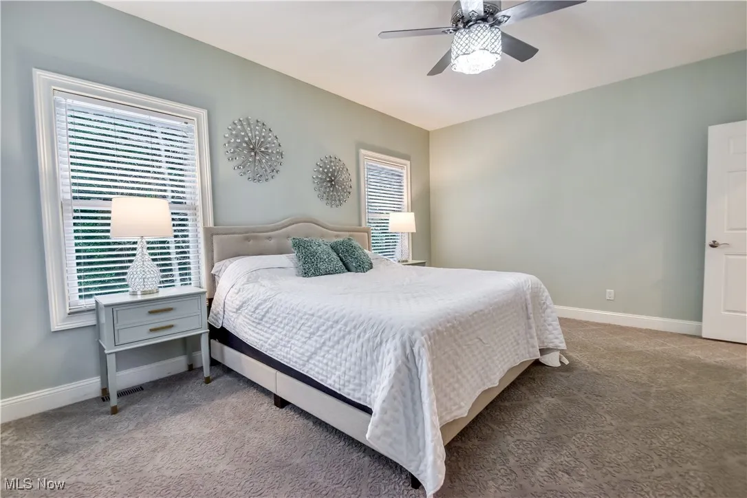 Bedroom featuring carpet and a ceiling fan