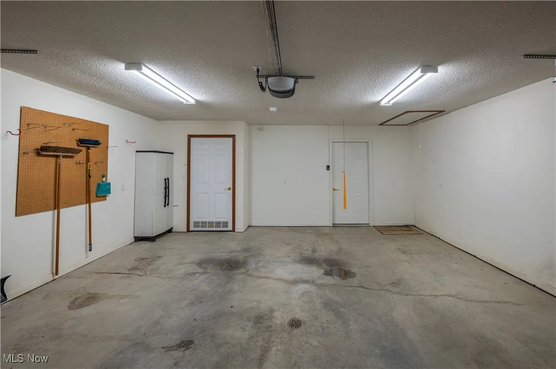 Garage featuring a garage door opener