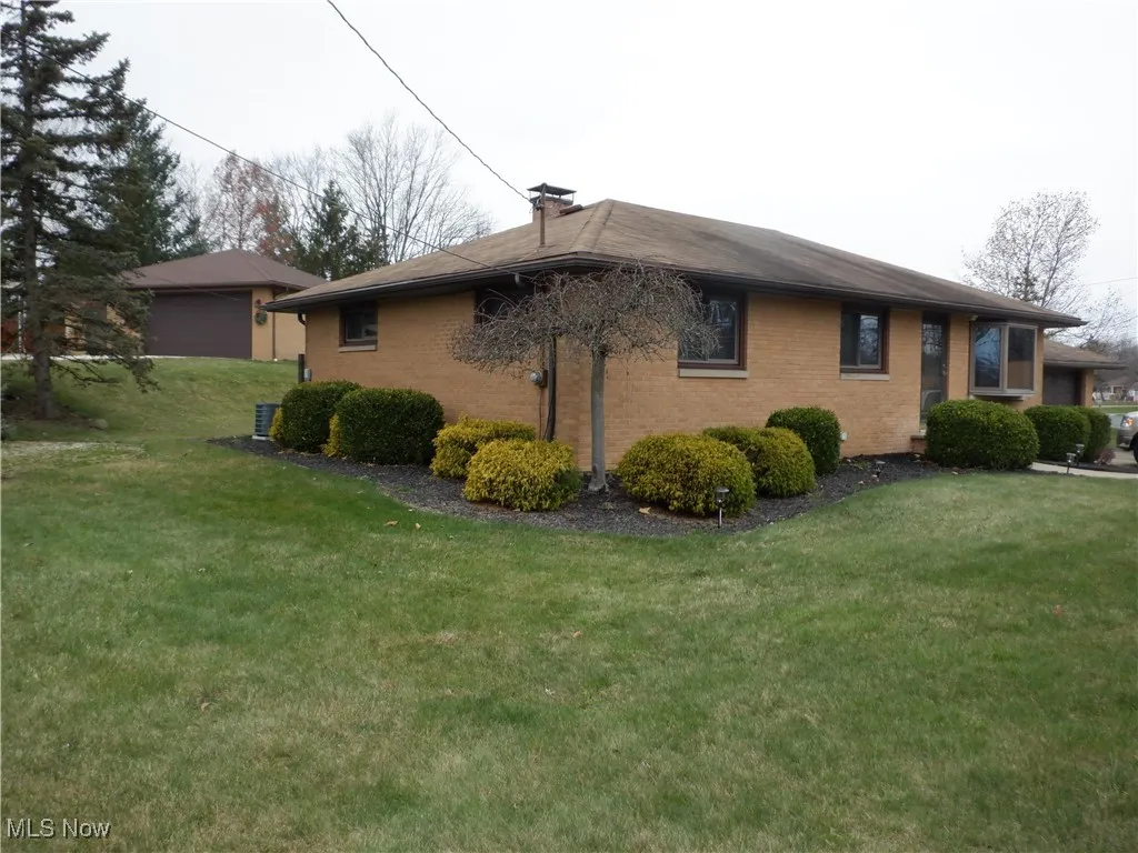 View of the side of home with a landscaping.
