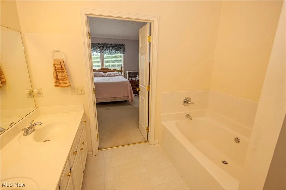 Ensuite bathroom with double vanity and a garden tub