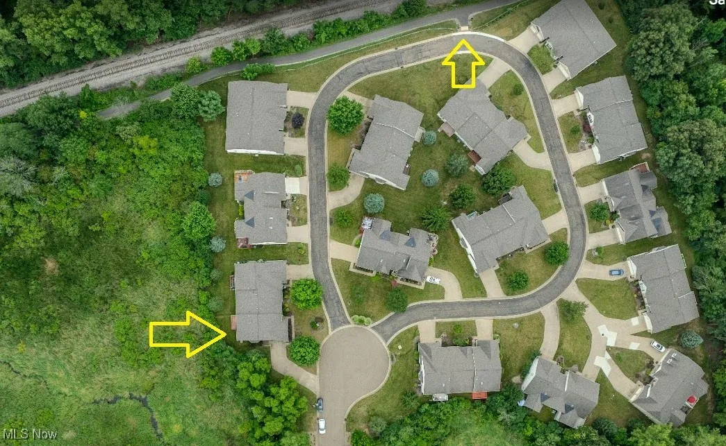 Aerial view of property's location featuring nearby suburban area