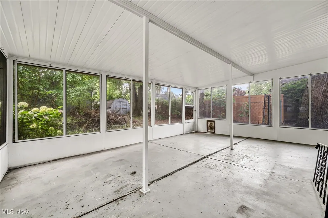 Unfurnished sunroom featuring plenty of natural light