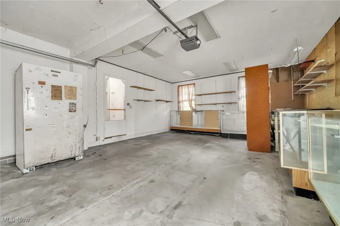 Garage featuring a garage door opener
