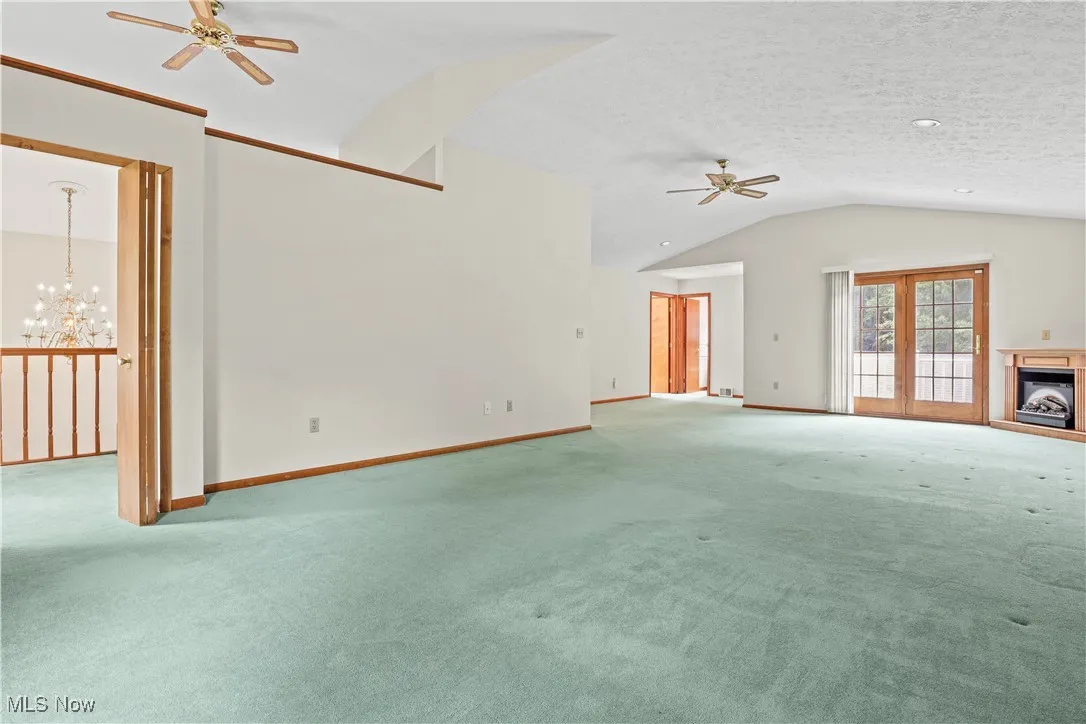 Spacious Master Suite with plenty of natural light and ceiling fans.