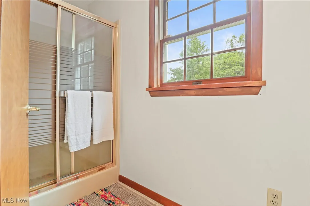 One of two Master Bathrooms off the Master Suite with an enclosed shower, soaking tub and double vanity.