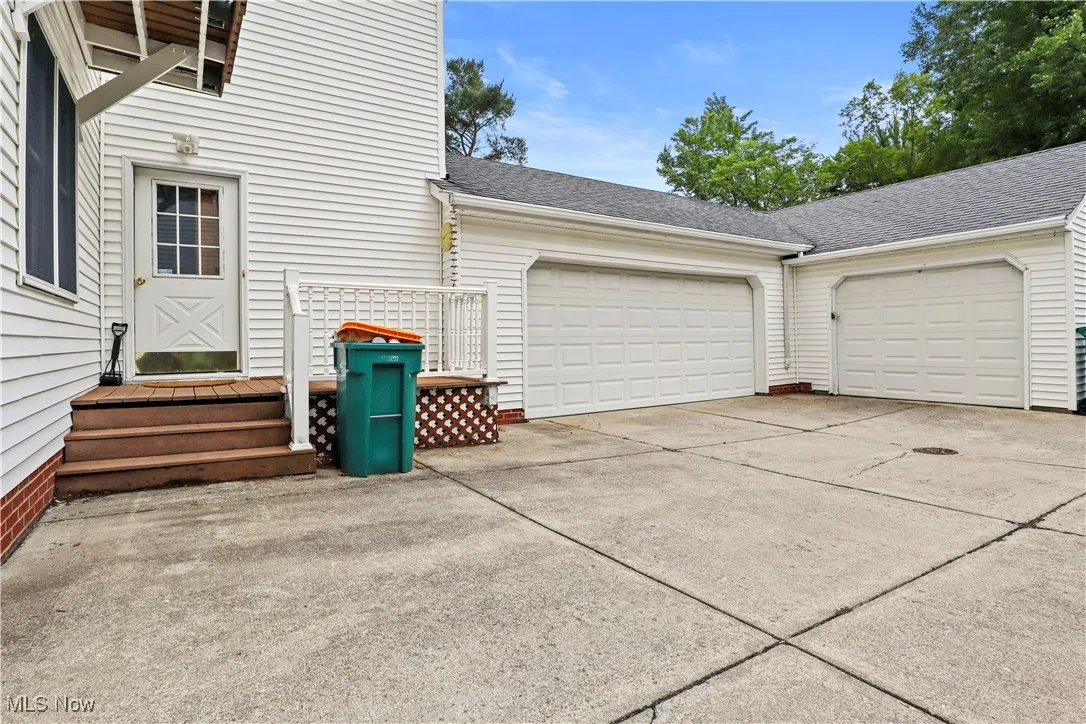 Garage with concrete driveway