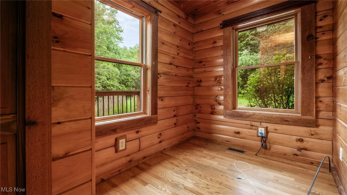 Unfurnished room featuring wood finished floors