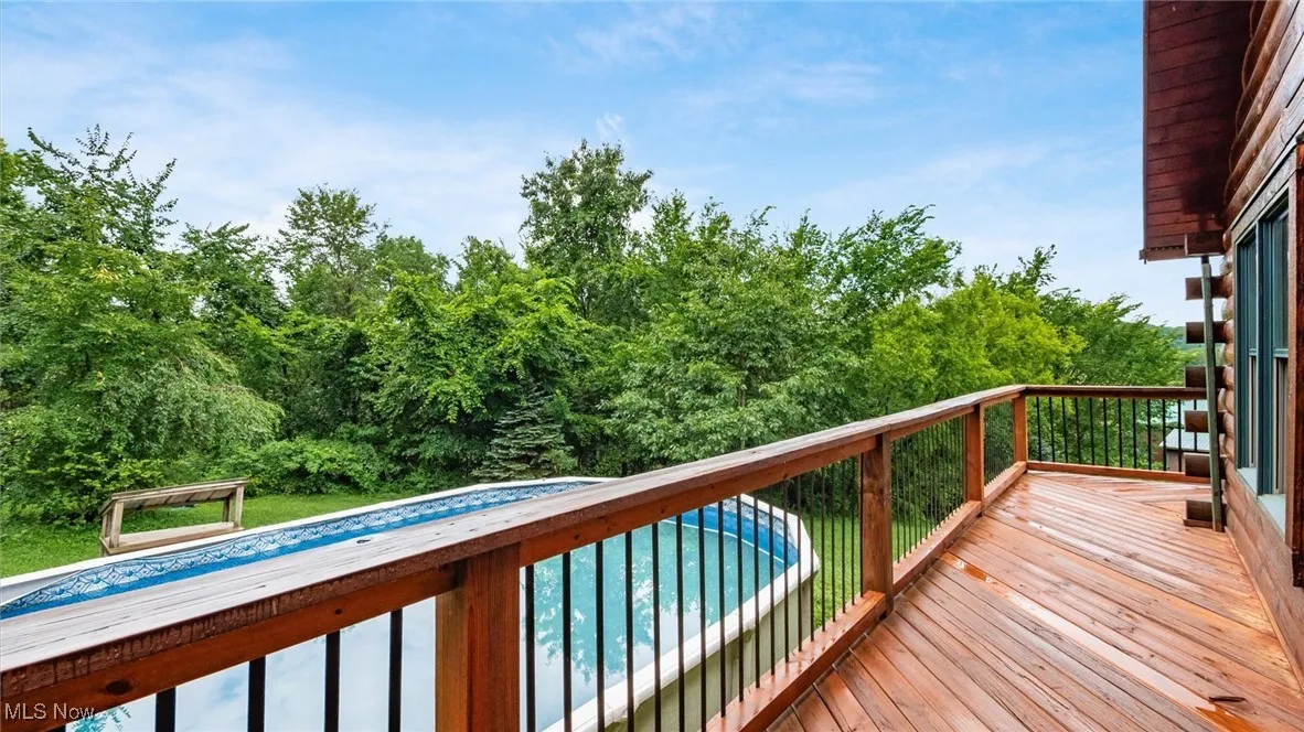 Wooden terrace with an outdoor pool