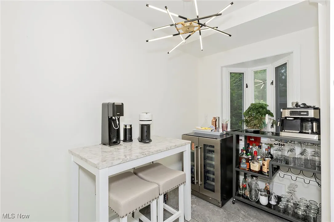 The kitchen currently serves as bar space, yet can flex for eat in space as well.