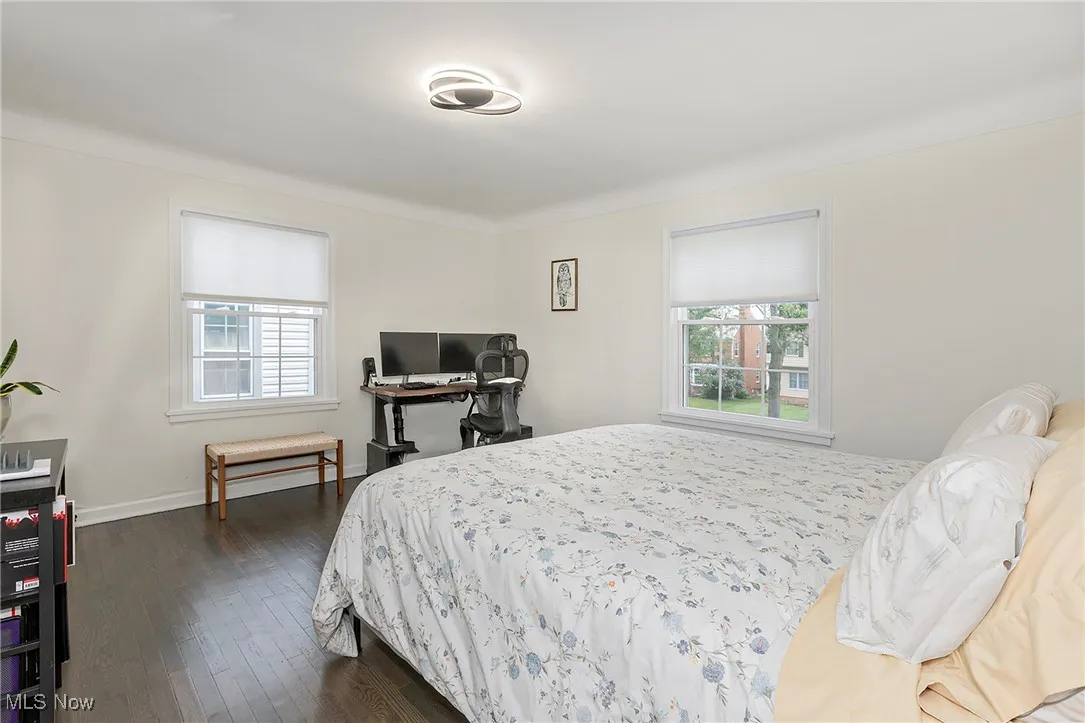 Custom window treatments on newer windows and more delightful hardwood flooring.